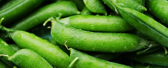 Pile of green peas. Fresh beans background. Vegan snacks 