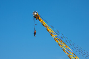 yellow crane in the port and blue sky background 