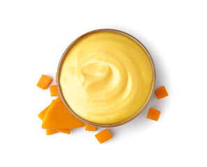 Bowl of tasty cheddar sauce with cheese slices on white background