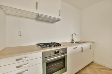 a kitchen area with an oven and dishwasher on the counter in this photo is taken from the inside