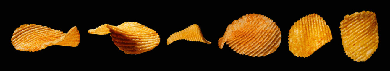 Potato chips isolated on black background