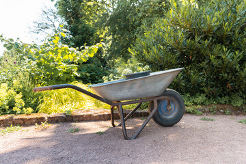 wheelbarrow in a garden. tools for planting and gardening. working in the garden.