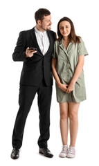 Bruised young woman with her husband on white background. Domestic violence concept