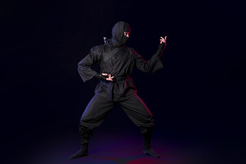 Male ninja on black background