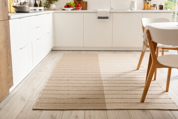 Stylish beige carpet in interior of modern kitchen