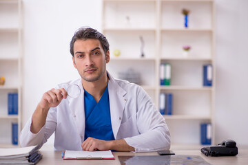 Young male doctor working in the clinic