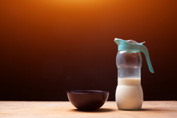  bottle with fresh milk for morning breakfast on wooden table