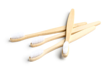 Many bamboo toothbrushes on white background