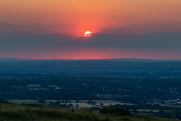 Looking out over fields in Sussex from Ditchling Beacon at sunset