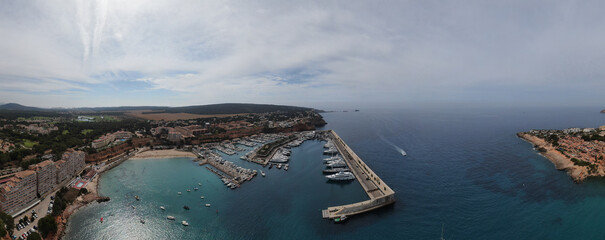  Panoramic view of Port Adriano in Majorca island. Beautiful scene of the seacost with a blue sea and Mediterranean landscape
