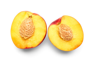 Halves of sweet peach on white background