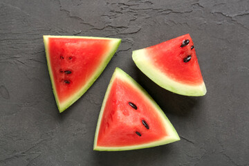 Pieces of fresh watermelon on black background