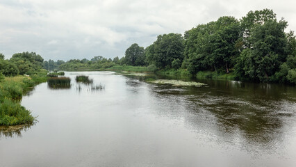 Fototapeta na wymiar Beautiful landscape of the Lithuanian river at the beginning of rain
