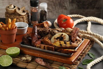 beef and pork meats on a wooden board