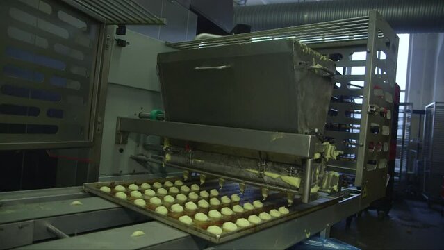 static wide shot of wind cake extruder with conveyor base