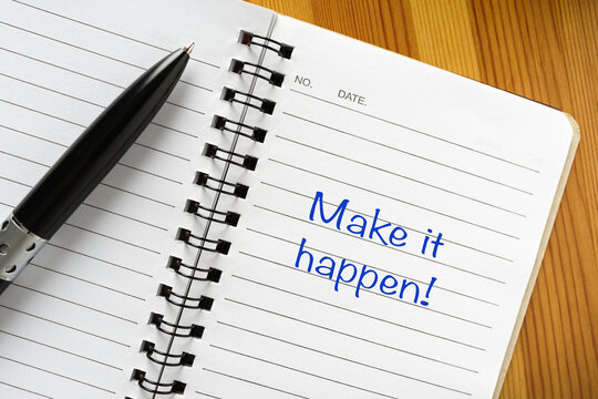 Make it happen!. Flat lay. Work area with notepad and pen.