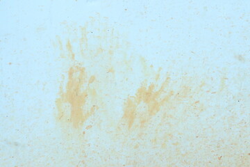 Texture of dirty walls with orange children's hand patterns. for background and wallpaper.
