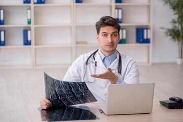 Young male doctor radiologist working in the clinic