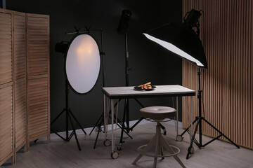 Composition with baked chicken, parsnip and strawberries on grey table in professional photo...