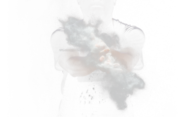 Chef prepare white flour dust for cooking bakery food. Elderly man Chef clap hand, white flour dust explode fly in air. Flour stop motion in air with freeze high speed shutter, black background