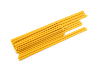 Bunch of church candles on white background, top view