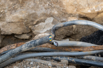 Cuted High voltage Electric Cables. Construction site with electric cables are buried underground,...
