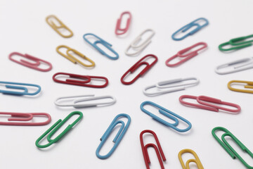 Colorful paper clip office business supplies isolated on white