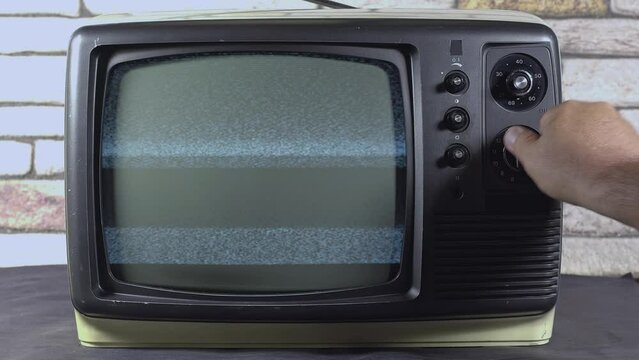 Manual Channel Tuning Noise Screen with Vintage Analog Tv Buttons Footage.