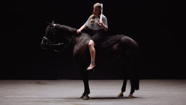 Lady Warrior Riding A Horse
