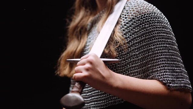 Close-up of Lady Warrior Hand with Sword