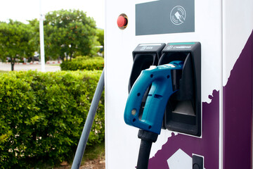 Electric car charging station outside the house. Eco car concept.