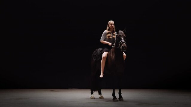 Lady Knight Riding Stallion In Studio