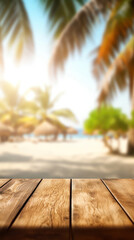 Fototapeta na wymiar Empty wooden table top with blurred sunny beach with palms background