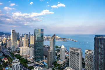 Obraz premium Aerial photography of modern architecture along the urban coastline of Qingdao