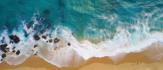 Capture the breathtaking sight of crashing waves on the shoreline with an overhead photo. Immerse yourself in the beauty of tropical beach surf and indulge in the abstract aerial view of the ocean.
