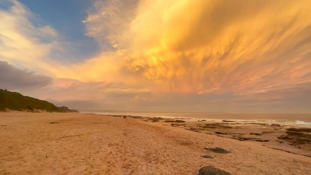 JBay Jefferey's Bay South Africa most stunning best ever incredible summer sunset thunderstorm clouds deep golden orange waves crash on beach shore Supers Impossible Boneyard surf paradise to left