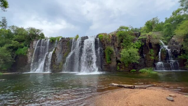 Forrest Lisbon Falls stunning peaceful waterfalls Sabie Nelsprit Johannesburg Mbombela South Africa most scenic cinematic spring greenery lush peaceful calm still water wide slow motion left pan beach
