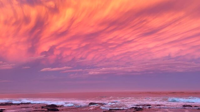 JBay Jefferey's Bay South Africa most stunning best ever incredible summer sunset thunderstorm clouds golden orange red pink waves crash on coastline shore Supers Impossible boneyard surf pan left