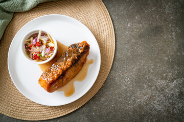 fried snapper fish with fish sauce and spicy salad