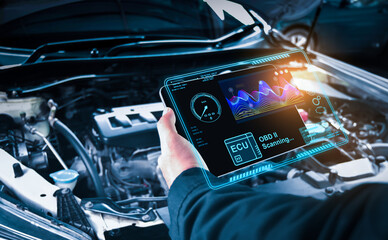 Auto mechanic checking ECU engine system with OBD2 wireless scanning tool and car information...