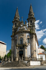 Fototapeta na wymiar Guimaraes, Portugal. April 14, 2022:Church and oratory of Our Lady of Consolation and Santos Passos. Architecture and facade with blue sky.