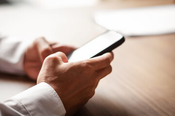 Close up of hands using smart phone electronic technology concept