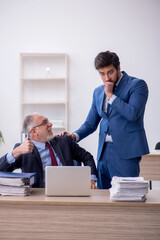 Two male colleagues working in the office