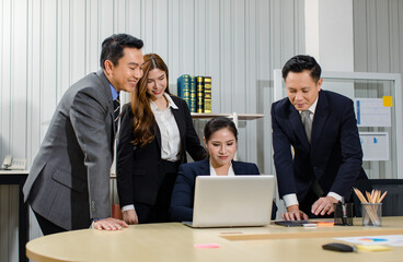 Asian professional successful male female businessmen businesswomen in formal business suit sitting standing talking in video call meeting online in laptop notebook computer