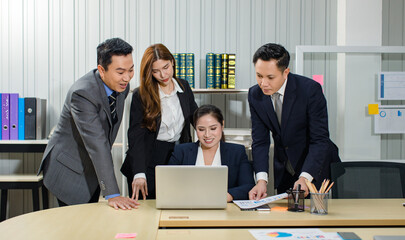 Asian professional successful male female businessmen businesswomen in formal business suit sitting standing talking in video call meeting online in laptop notebook computer