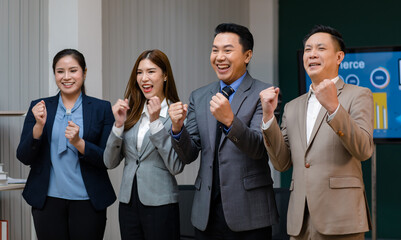 Millennial Asian professional successful male female businessmen businesswomen group in formal business suit standing together showing teamwork union unity in meeting room