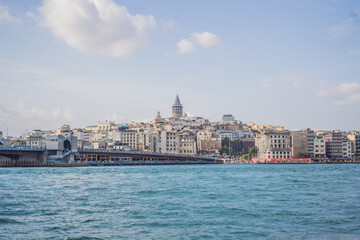 Fototapeta premium Istanbul city skyline in Turkey, Beyoglu district old houses with Galata tower on top, view from the Golden Horn