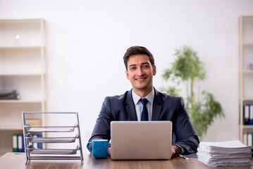 Young male employee working in the office