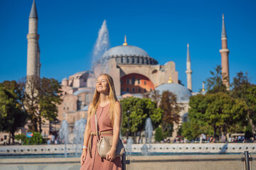 Woman enjoy beautiful view on Hagia Sophia Cathedral, famous islamic Landmark mosque, Travel to...