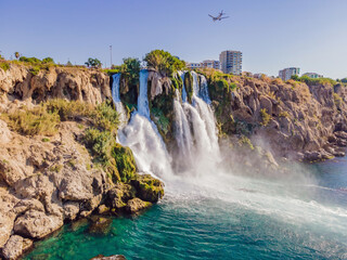 Fototapeta premium Lower Duden Falls drop off a rocky cliff falling from about 40 m into the Mediterranean Sea in amazing water clouds. Tourism and travel destination photo in Antalya, Turkey. Turkiye.